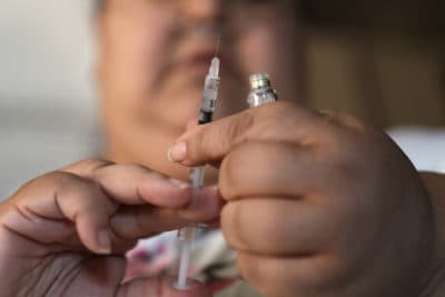 In this April 18, 2017 file photo, a woman with Type 2 diabetes prepares to inject herself with insulin at her home in Las Vegas. (John Locher/AP)