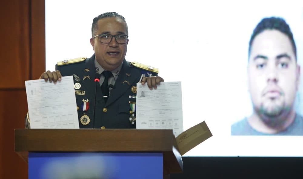 The director of the National Police, Maj. Gen. Ney Aldrin Bautista Almonte, gives new details Thursday on the attack on David Ortiz, in front of an image of Victor Hugo Gomez. According to Rodríguez, Ortiz was shot by a gunman who mistook him for the real target, Sixto David Fernández, and the attempted murder was ordered from the United States by Hugo Gomez, Fernández's cousin. (Roberto Guzman/AP)