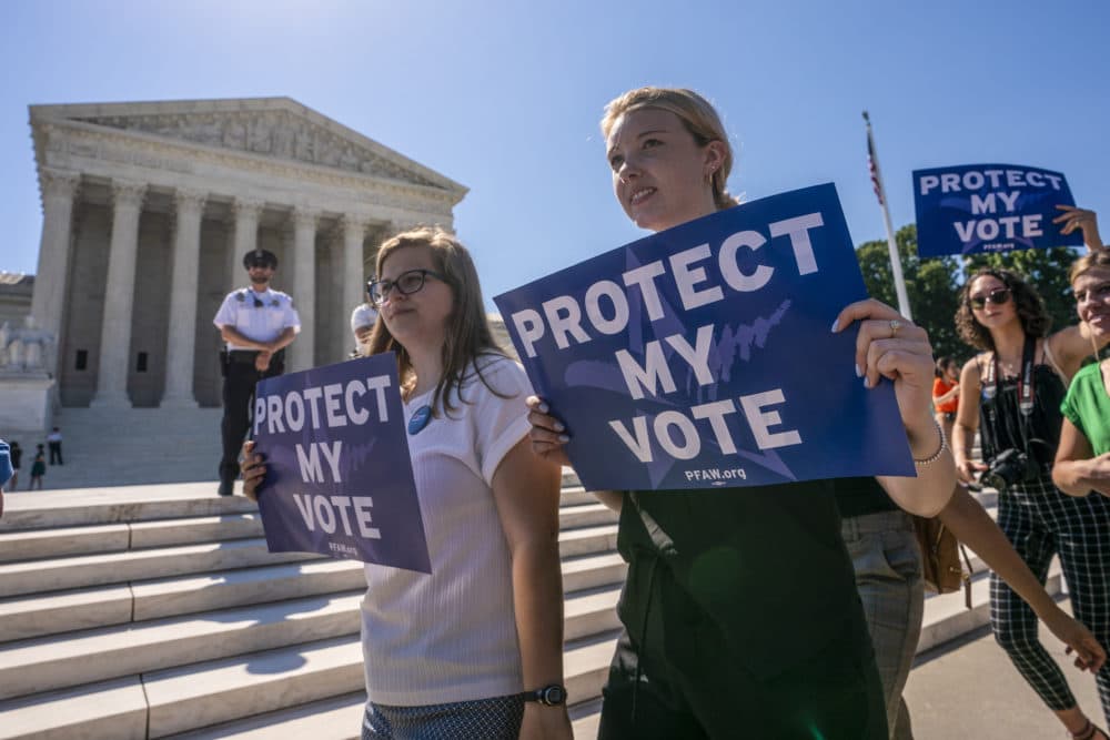 Demonstrators gather at the Supreme Court as the justices finish the term with key decisions on gerrymandering and a census case on Capitol Hill in Washington, Thursday, June 27, 2019. (J. Scott Applewhite/AP)