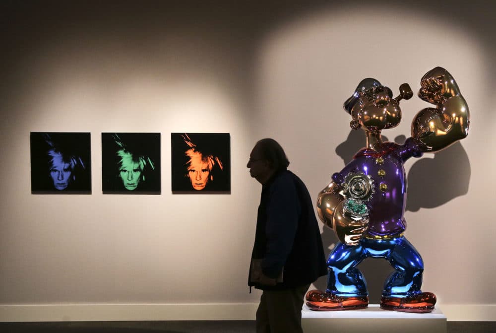 Jeff Koons' "Popeye" is seen at right at Sotheby's in New York before its 2014 sale to Steve Wynn. (Julie Jacobson/AP)