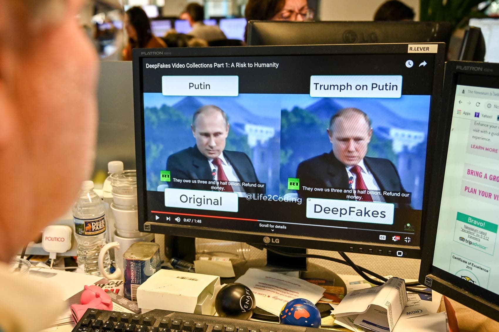 A journalist views a video on Jan. 25, 2019, manipulated with artificial intelligence to potentially deceive viewers. (Alexandra Robinson/AFP/Getty Images)