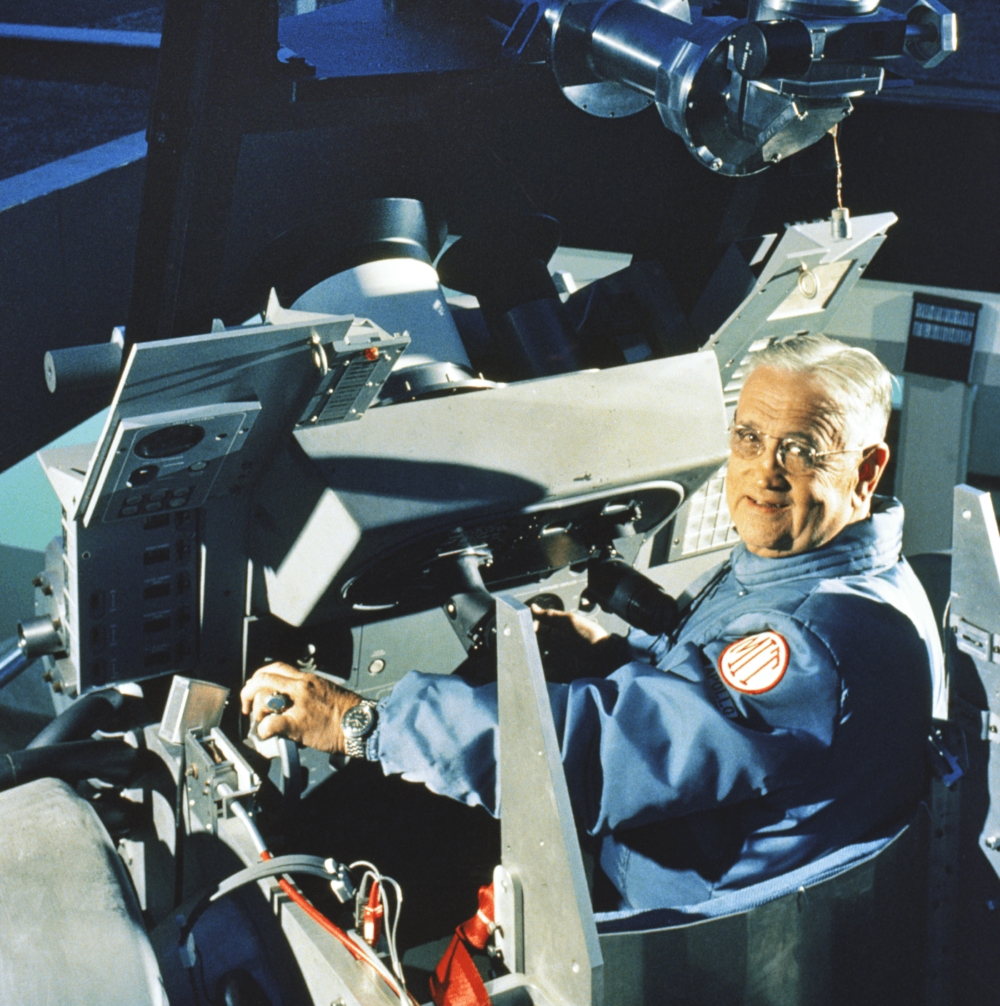 Dr. Charles "Doc" Stark Draper, head of the MIT Instrumentation Laboratory and later founder of the Draper Laboratory, sits in the Apollo Navigation Simulator on the lab’s roof at MIT. (Courtesy of Draper)