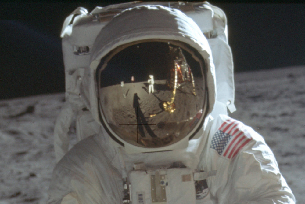 Neil Armstrong is reflected in the helmet visor of Buzz Aldrin on the surface of the moon. The astronauts had a camera mounted to the front of their suits. (Neil Armstrong/NASA via AP)