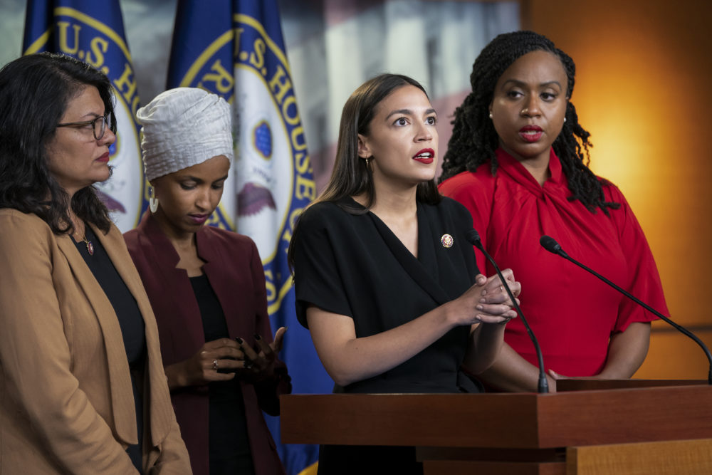 From left, Rep. Rashida Tlaib, D-Mich., Rep. Ilhan Omar, D-Minn., Rep. Alexandria Ocasio-Cortez, D-N.Y., and Rep. Ayanna Pressley, D-Mass., respond to remarks by President Donald Trump after his call for the four Democratic congresswomen to go back to their "broken" countries. (J. Scott Applewhite/AP)