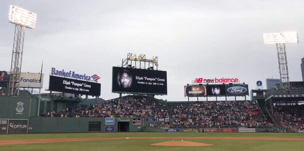 Fans stand for a moment of silence dedicated to Boston Red Sox great Elijah "Pumpsie" Green, the team's first black player who passed away earlier in the day, prior to a game at Fenway Park. (Charles Krupa/AP)