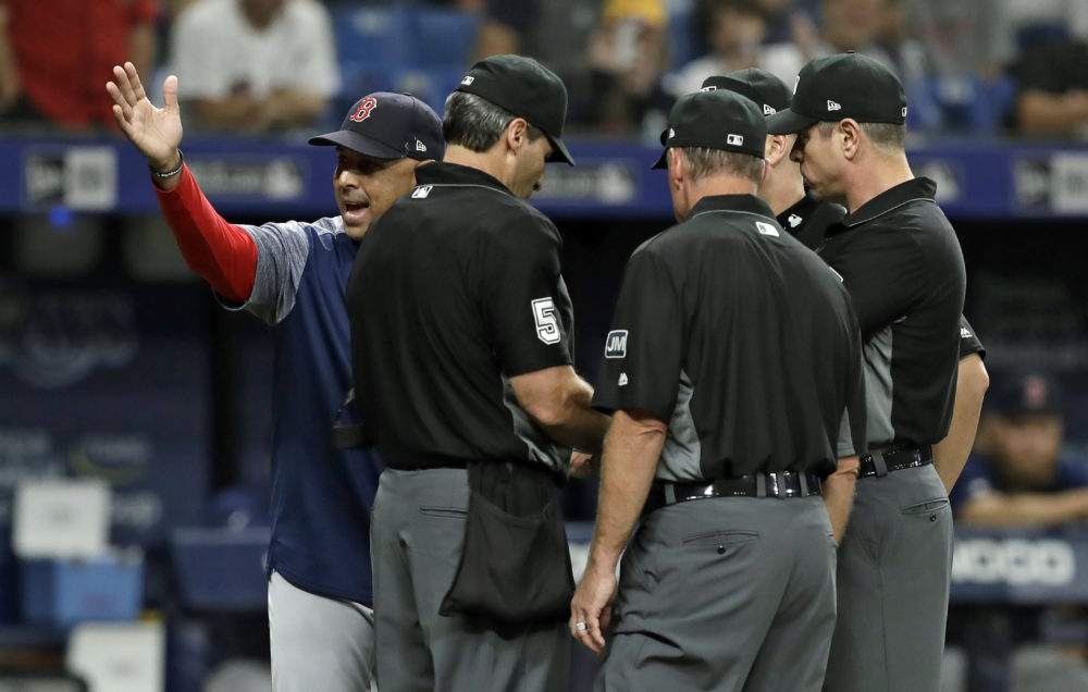 Boston Red Sox manager Alex Cora yells at umps during the eighth inning of a Red Sox-Rays game on July 24. (Chris O'Meara/AP)