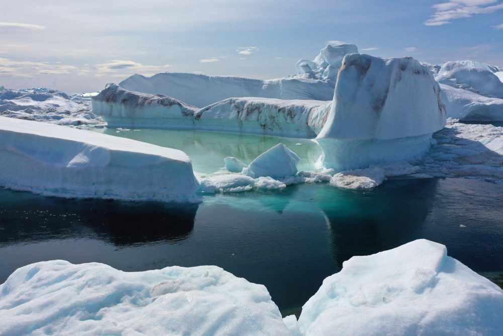 Climate change is having a profound effect in Greenland, where over the last several decades summers have become longer and the rate that glaciers and the Greenland ice cap are retreating has accelerated. (Sean Gallup/Getty Images)
