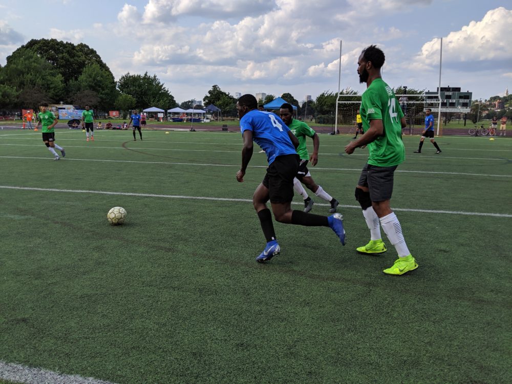 The Boston Unity Cup brings together local players that represent more than 20 countries. Here, the Cape Verde and Sudan (green) teams fight for the ball in the men's final. (Courtesy of Boston Unity Cup)