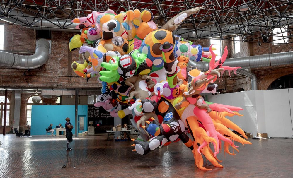 Nick Cave looks at his sculpture at the BCA for his project "Augment," commissioned by Boston's Now + There. (Robin Lubbock/WBUR)