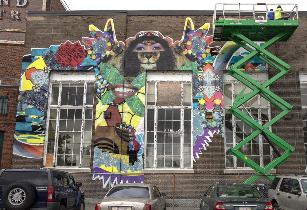 A mural at 555 Columbia Road in Uphams Corner is part of the "Augment" project. In this photo, the artwork was still being installed. (Robin Lubbock/WBUR)