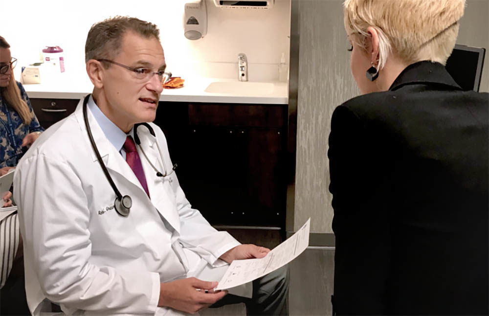 Dr. Robert C. Green consults with a patient at the new Preventive Genomics Clinic at Brigham and Women's Hospital. (Carey Goldberg/WBUR)