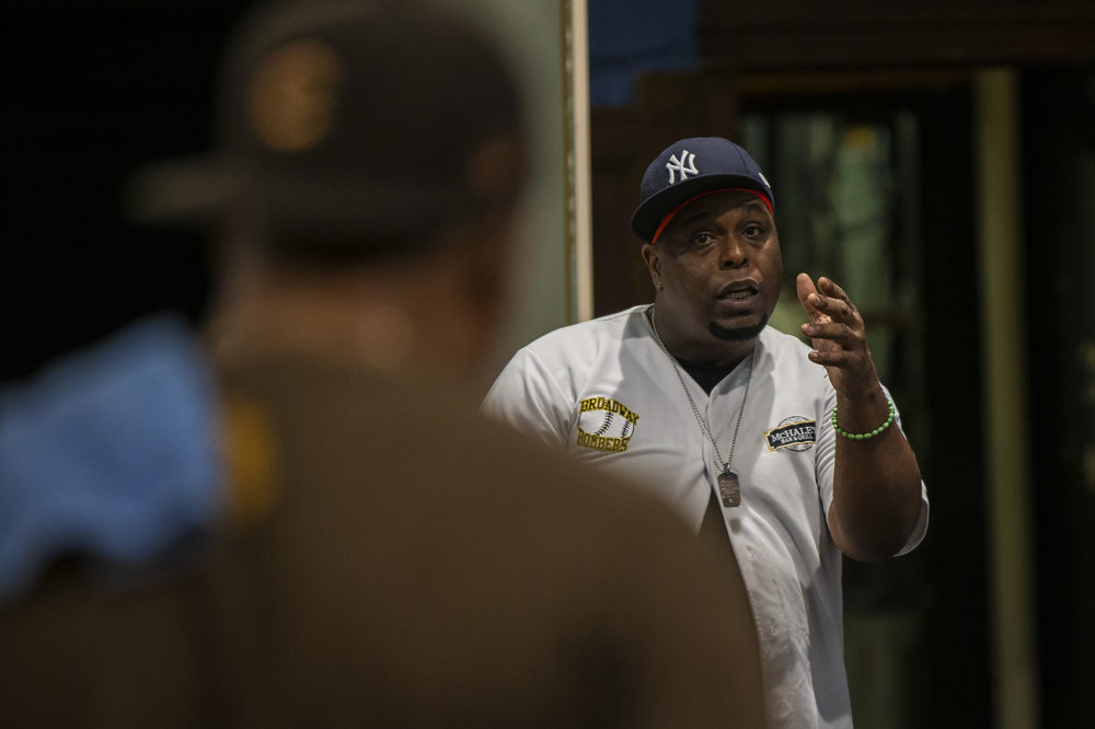 J. Bernard Calloway as Mr. Bugz (right) and Morocco Omari as Lamont rehearse a scene of "The Purists". (Jesse Costa/WBUR)