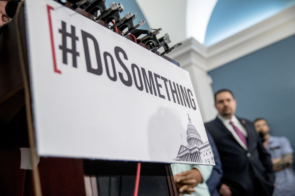 The hashtag "#DoSomething" is displayed as trauma surgeon and gun control activist Dr. Joe Sakran takes the podium during a news conference calling for Senate action on H.R. 8 - Bipartisan Background Checks Act of 2019, on Capitol Hill in Washington, Tuesday, Aug. 13, 2019. (Andrew Harnik/AP)