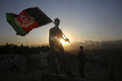 A man waves an Afghan flag during Independence Day events in Kabul, Afghanistan, Monday, Aug. 19, 2019. (Rafiq Maqbool/AP)