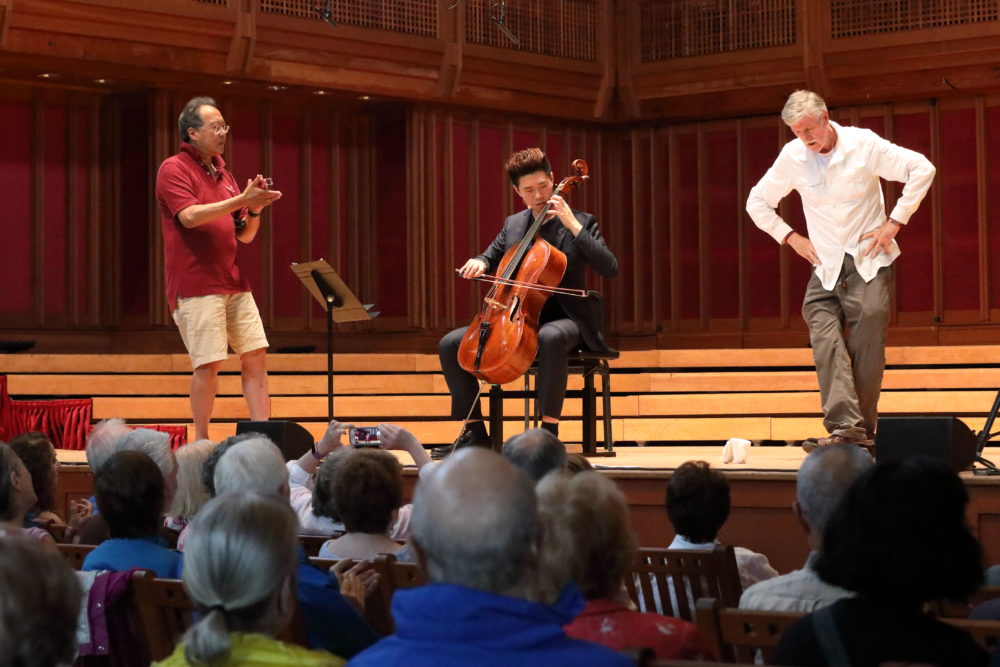 Yo-Yo Ma, Tanglewood Music Center fellow Shangwen Liao, and an Irish step-dancing audience member explore the Bach Cello Suites. (Courtesy of Hilary Scott)