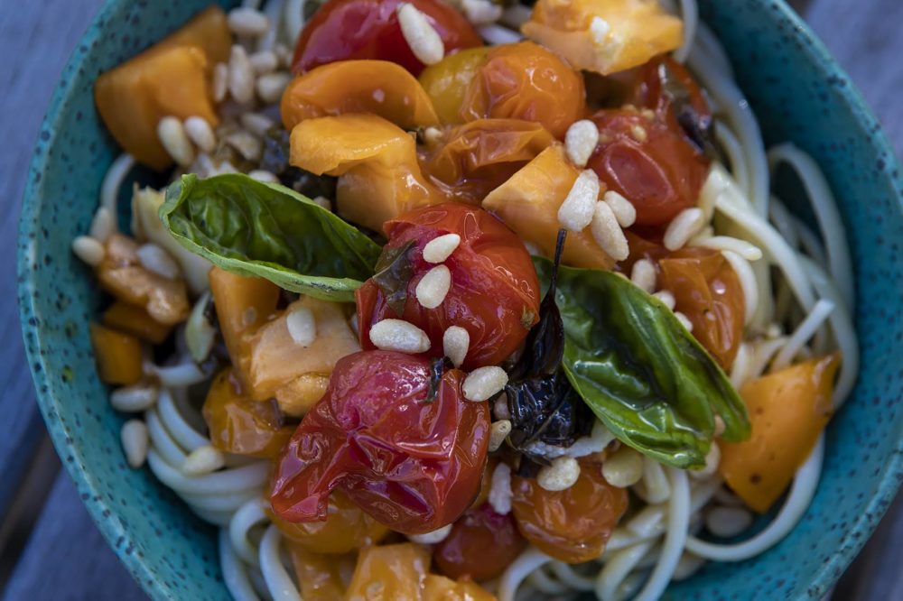 Linguine with roasted cherry tomatoes and garlic, fresh tomatoes, pine nuts and herbs. (Jesse Costa/WBUR)
