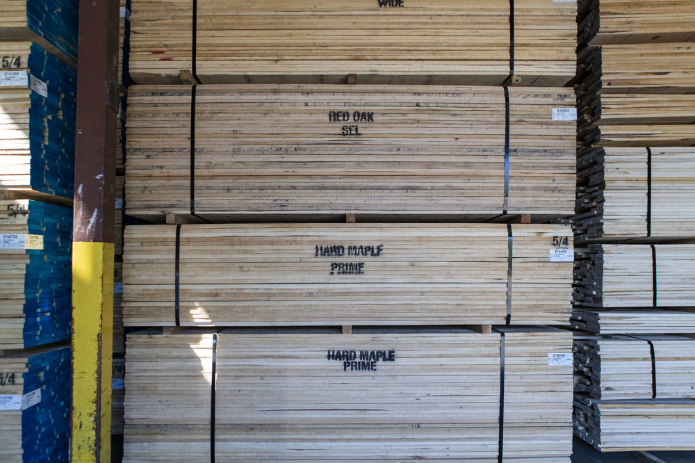 Stacks of oak and maple boards are ready for shipment at Allard Lumber. (Jesse Costa/WBUR)
