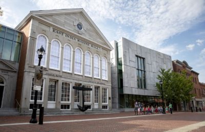 The granite facade of the PEM's new wing (on the right) stands beside the museum's historic East India Marine Hall. (Robin Lubbock/WBUR)