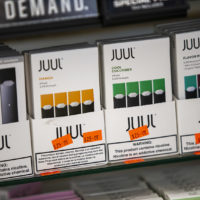 Various Juul products are on display at Fast Eddie's Smoke Shop in Allston. (Jesse Costa/WBUR)