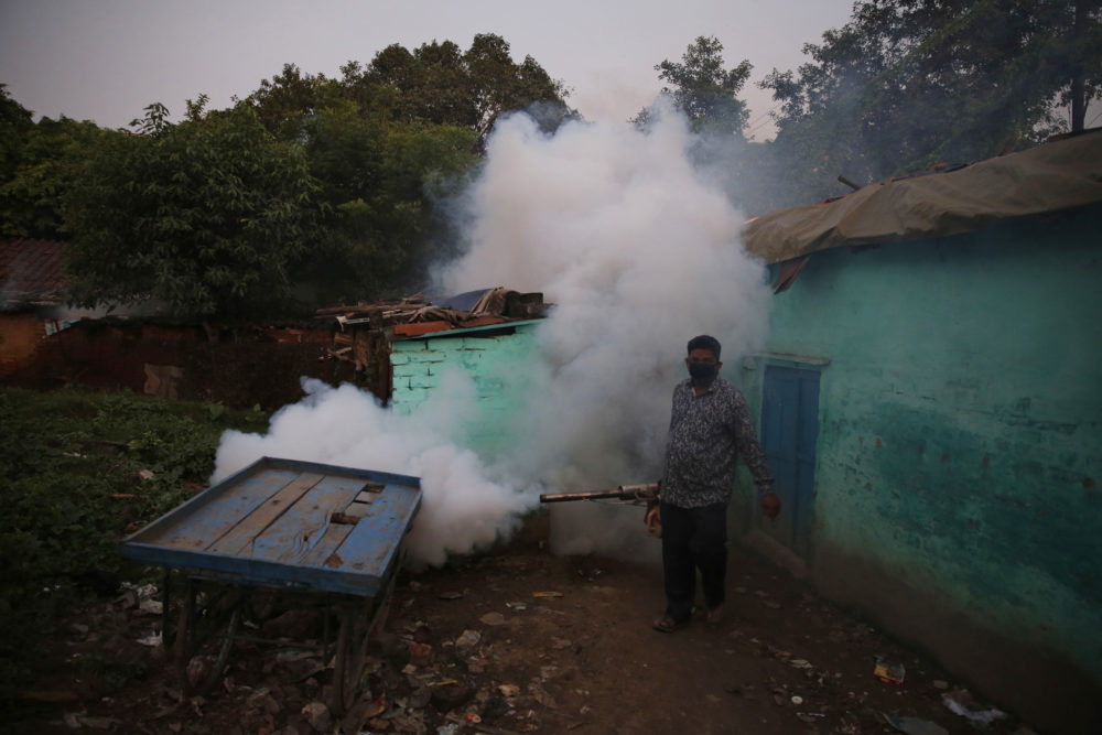 A health worker fumigates an area to prevent the spread of mosquito-borne diseases in Allahabad, India, on Sept. 13, 2018. (Rajesh Kumar Singh/AP)