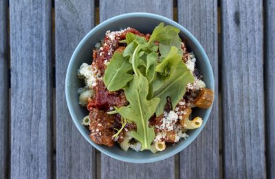 Pasta with sausage, tomato sauce and arugula. (Jesse Costa/WBUR)