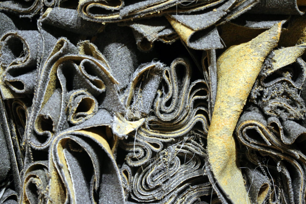 Detail shot from Faheem Majeed's "Planting and Maintaining a Perennial Garden: Indebted Mass," 2019. (Courtesy of the Artist and Tufts University Art Galleries)