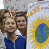Swedish youth climate activist Greta Thunberg, center in blue, joins other young climate activists Friday for a climate strike outside the White House in Washington, Friday, Sept. 13, 2019. (Susan Walsh/AP)