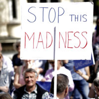 Pro-EU supporters hold signs during a demonstration outside a meeting between British Prime Minister Boris Johnson and Luxembourg's Prime Minister Xavier Bettel in Luxembourg,  Sept. 16, 2019. (Olivier Matthys/AP)