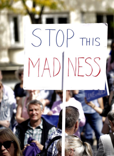 Pro-EU supporters hold signs during a demonstration outside a meeting between British Prime Minister Boris Johnson and Luxembourg's Prime Minister Xavier Bettel in Luxembourg, Sept. 16, 2019. (Olivier Matthys/AP)