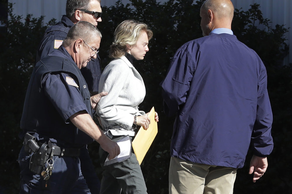 Michelle Carter, center, is escorted to a parole hearing, Sept. 19, 2019, in Natick, Mass. (Steven Senne/AP)