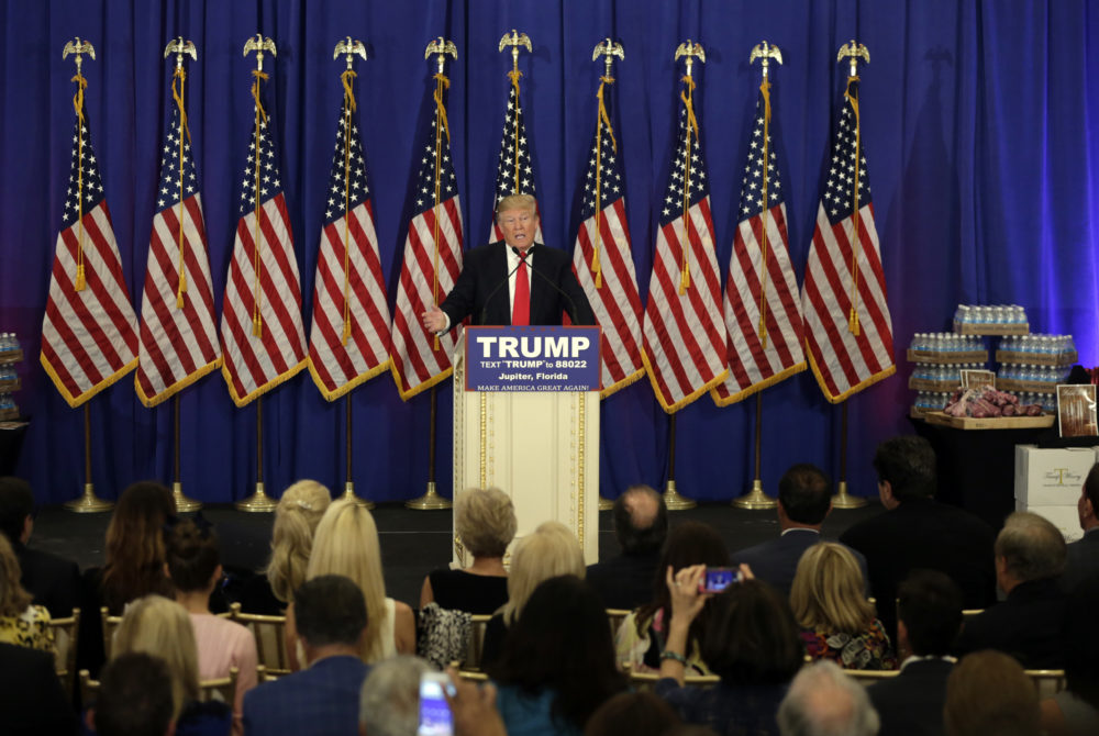 Donald Trump, then a Republican presidential candidate, speaks during a news conference at the Trump National Golf Club, Tuesday, March 8, 2016, in Jupiter, Fla. On display on the right is Trump branded water and steak. (Lynne Sladky/AP)