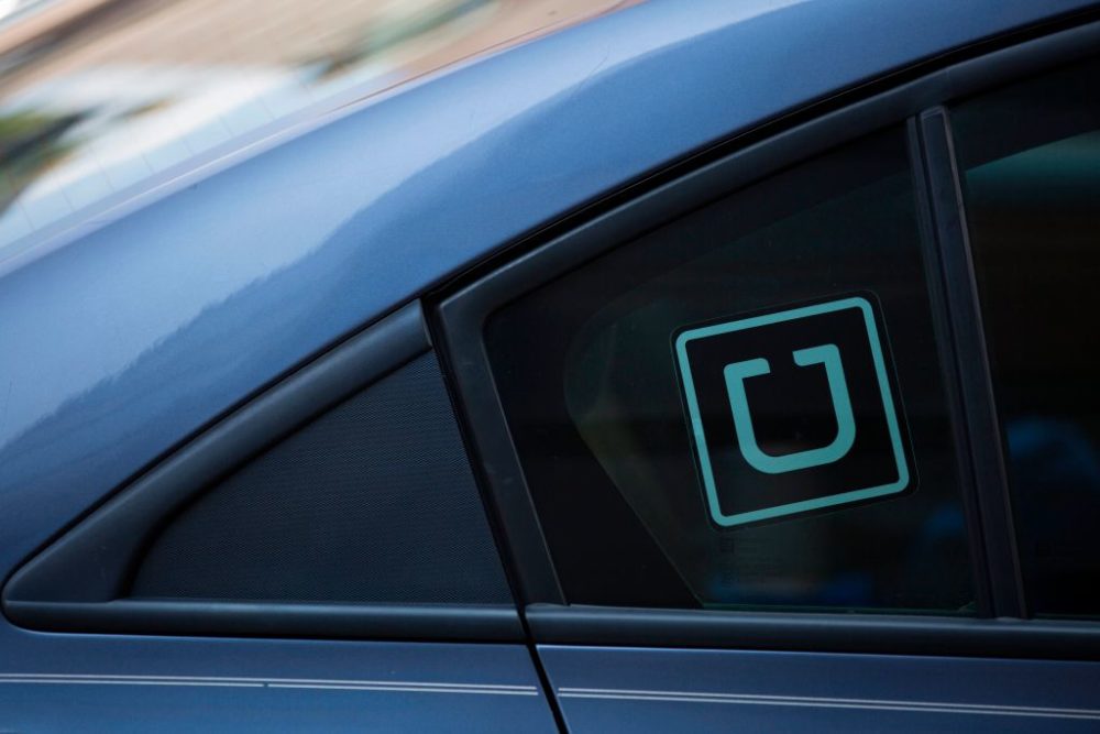 The Uber logo is seen on a car in Washington, DC, on July 9, 2019. (Alastair Pike/Getty Images)