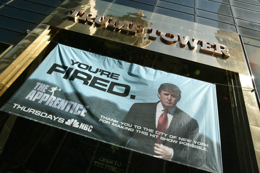 A sign advertising the television show "The Apprentice" hangs at Trump Towers April 15, 2004 in New York City. (Peter Kramer/Getty Images)