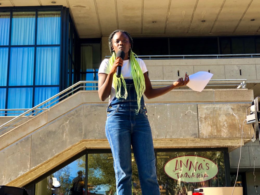 MIT Media Lab graduate student Arwa Mboya speaks at a rally outside the Stratton Student Center on Friday. (Max Larkin/WBUR)