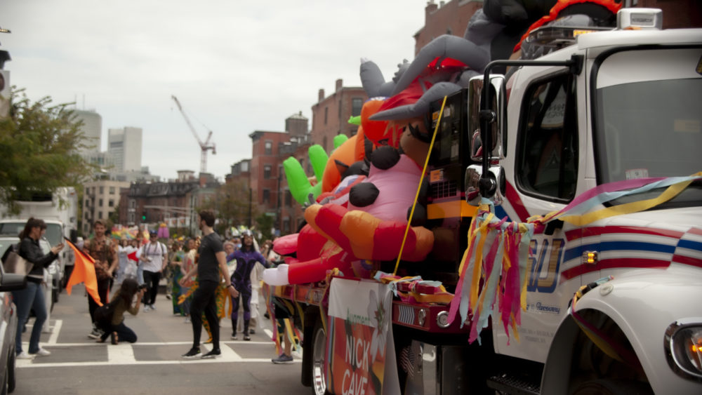 The parade makes its way through the South End. (OJ Slaughter for WBUR)