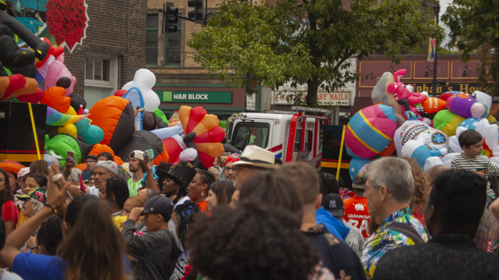 The parade grows in size as it reached Upham's Corner. (OJ Slaughter for WBUR)