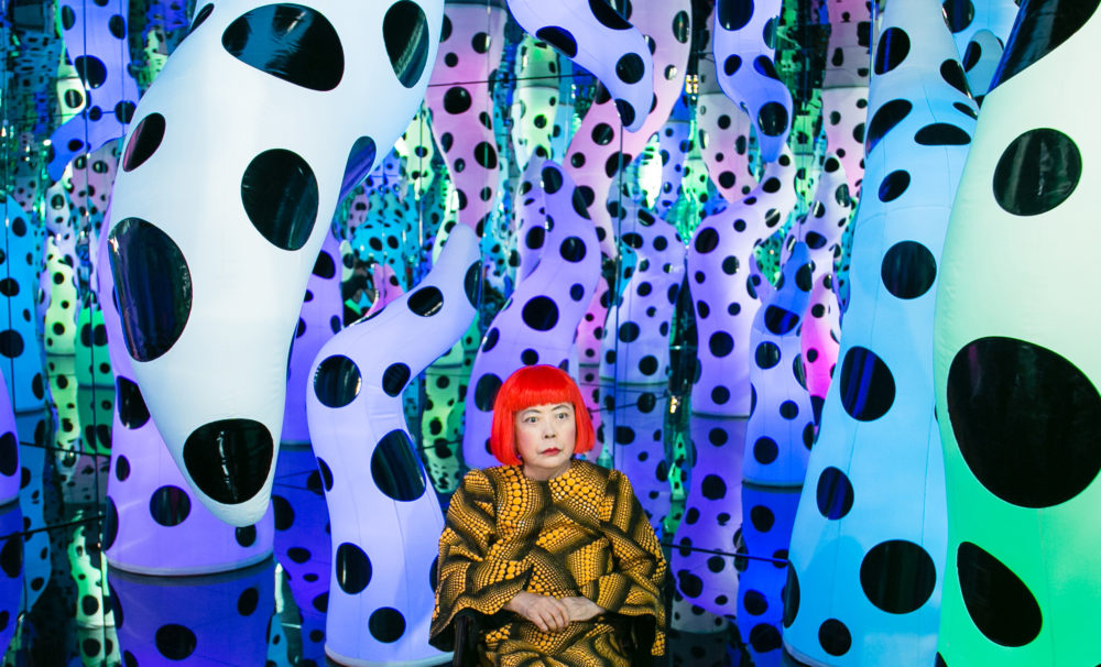 Yayoi Kusama pictured with her work "Love Is Calling," during her solo exhibition "I Who Have Arrived In Heaven" at David Zwirner, New York in 2013. (Courtesy David Zwirner, New York; Ota Fine Arts, Tokyo/Singapore/Shanghai; Victoria Miro, London/Venice)