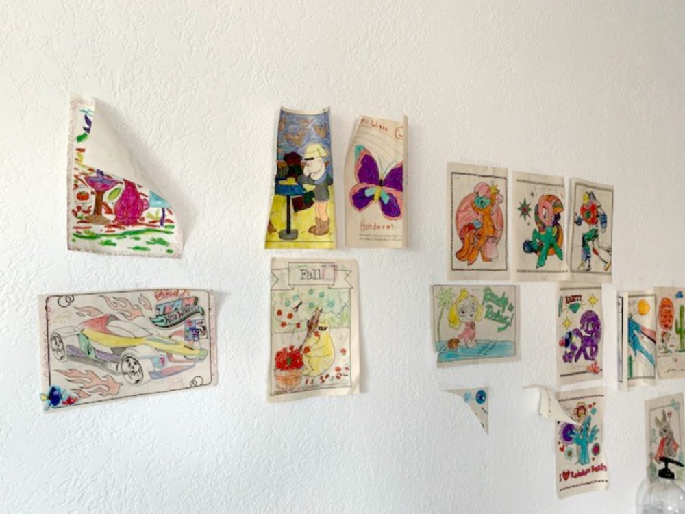 Children's art hangs on the walls at the Humanitarian Respite Center in McAllen, Texas. (Courtesy)