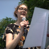 The author speaking at an event near the Massachusetts State House in June 2019. (Courtesy Eben Bein for Our Climate)