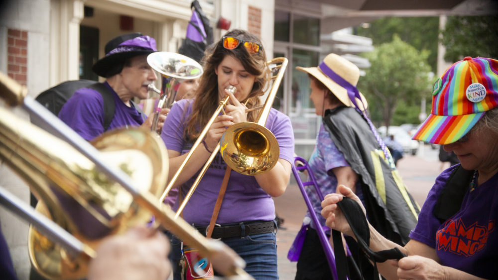 JP Honk, a band that describes its sound as an "exuberant street style," prepares to join the parade. (OJ Slaughter for WBUR)