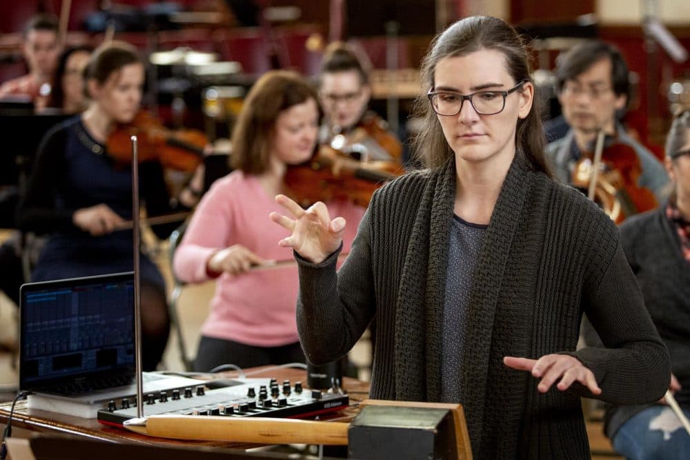 Theremin virtuoso Carolina Eyck rehearses "Sirens: A Concerto for Theremin and Orchestra" with the Boston Modern Orchestra Project. (Robin Lubbock/WBUR)