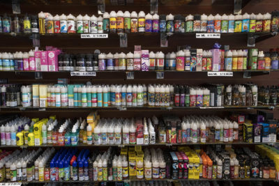 Shelves of vaping juices along a wall at Smoker Choice in Salem, NH. (Jesse Costa/WBUR)