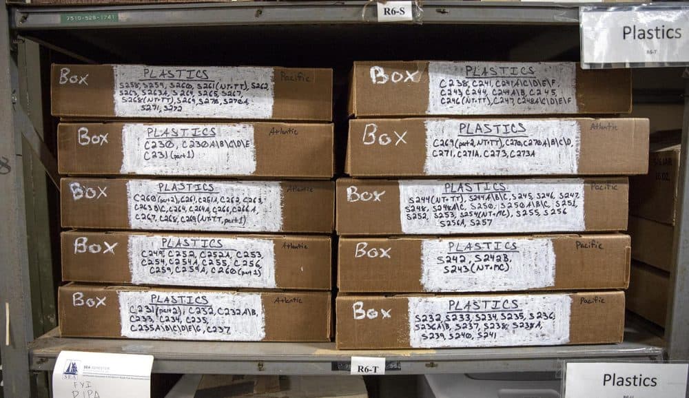 Boxes at SEA filled with vials of plastic material gathered from ocean tows. (Robin Lubbock/WBUR)
