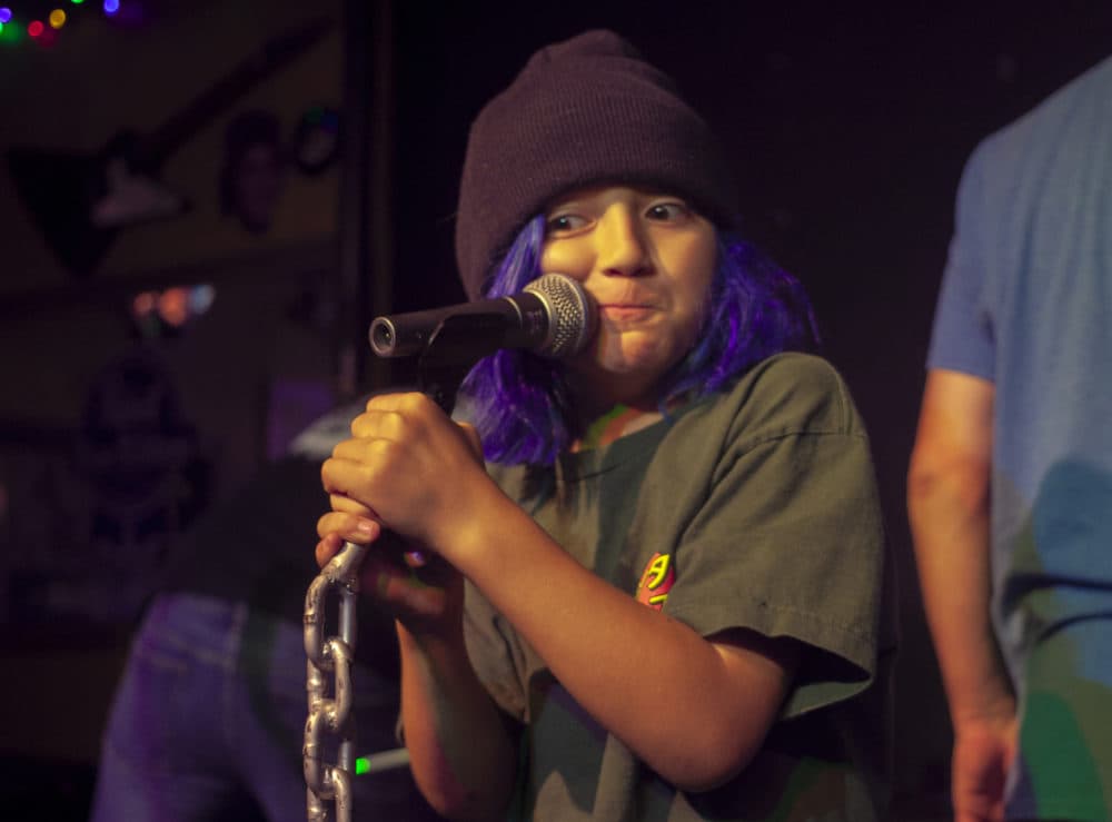 10-year-old Lincoln Zinzola gets ready for a show at The Midway Cafe. (OJ Slaughter for WBUR)