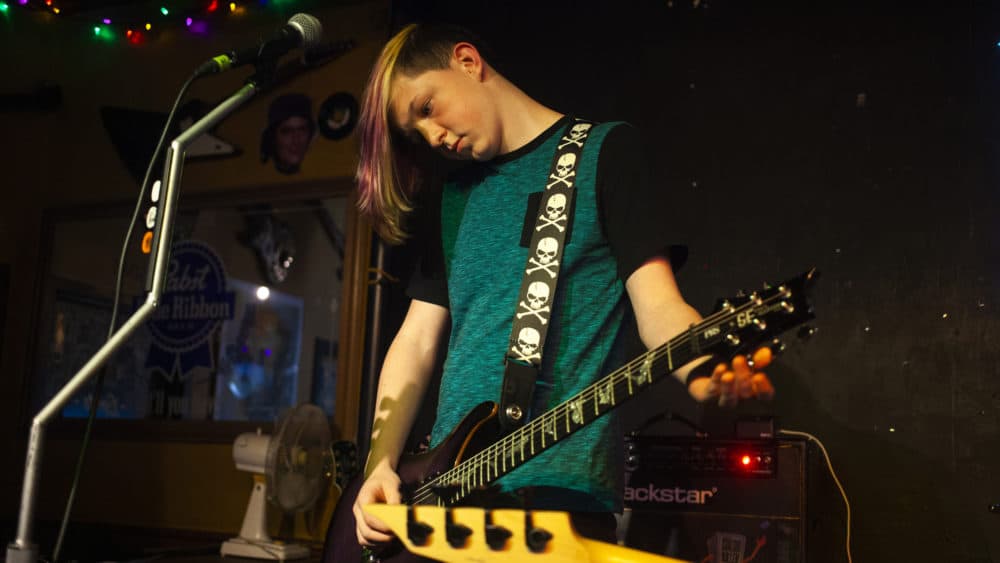 13-year-old Dylan Huther plays guitar. (OJ Slaughter for WBUR)