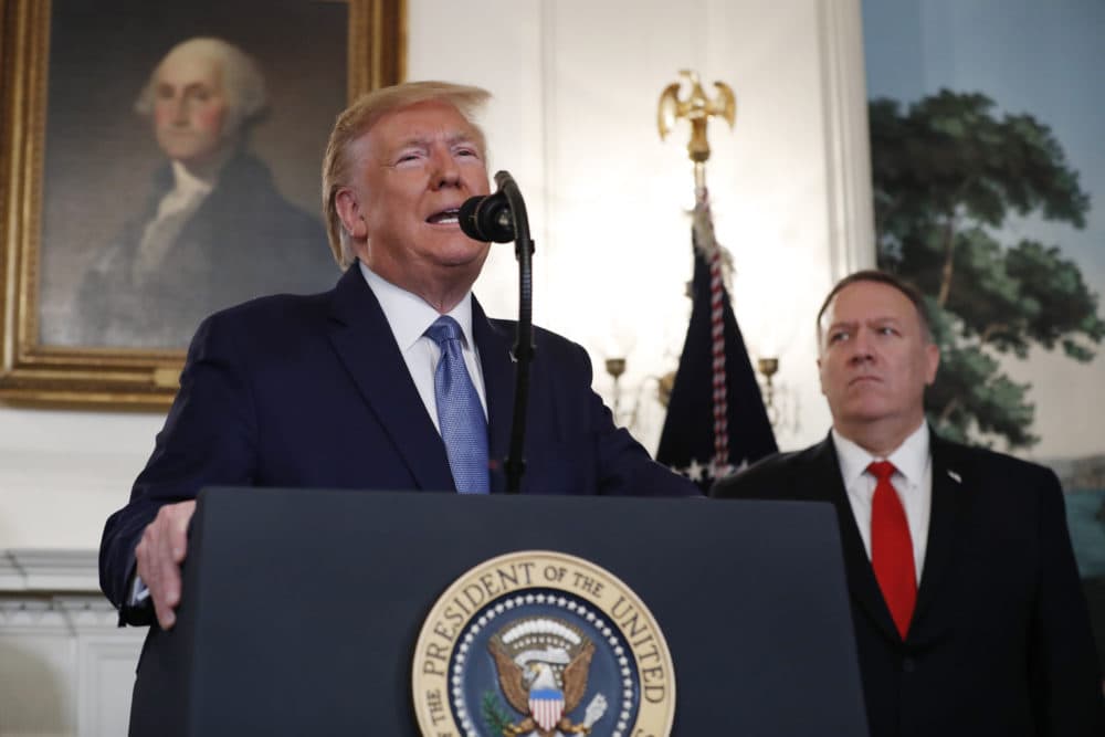 President Trump, accompanied by Secretary of State Mike Pompeo, speaks in the Diplomatic Room of the White House in Washington. (Jacquelyn Martin/AP)