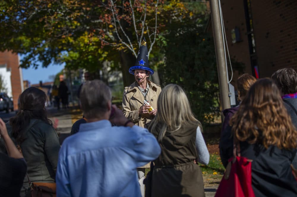 Christine Remus, of Salem Historical Tours, leads one of the many tours around Salem provided by tour companies this time of the year. (Jesse Costa/WBUR)