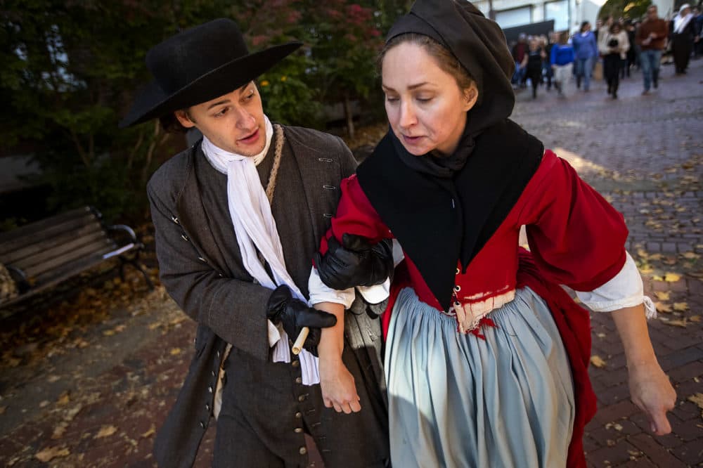 Tourists follow performers to the Old Town Hall in Derby Square for the reenactment of the witchcraft trial of Bridget Bishop, the first person to be hanged in the Salem witch trials of 1692. (Jesse Costa/WBUR)