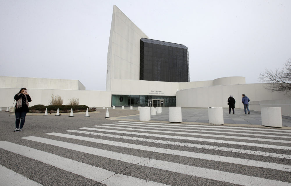 Passers-by walk near an entrance to the John F. Kennedy Presidential Library and Museum in Boston (AP Photo/Steven Senne)