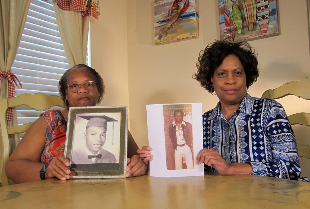 In this Wednesday, April 10, 2019, photo Mylinda Byrd Washington, 66, left, and Louvon Byrd Harris, 61, hold up photographs of their brother James Byrd Jr. in Houston. James Byrd Jr. was the victim of what is considered to be one of the most gruesome hate crime murders in recent Texas history. (Juan Lozano/AP)